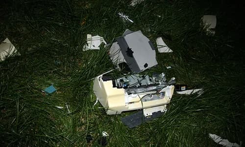 Broken printer in a field